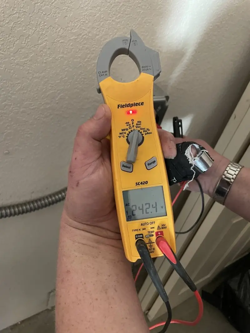 Voltage testing with clamp meter during Generator Installation in Paradise Valley